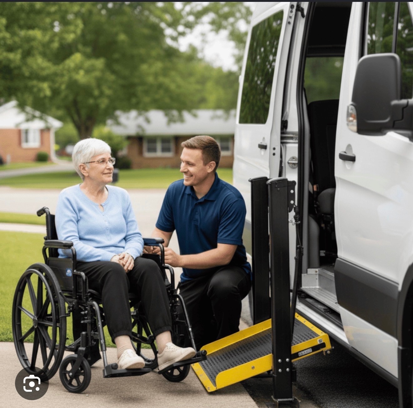 A caregiver assists a wheelchair passenger beside an accessible van.